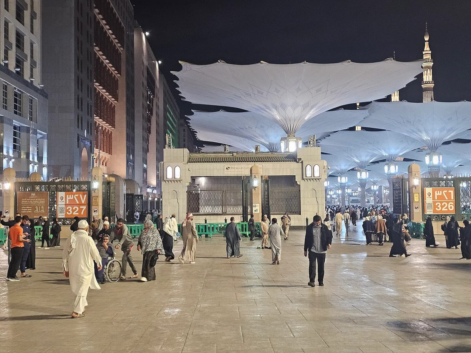 The Prophet's Mosque courtyard under its umbrellas at night