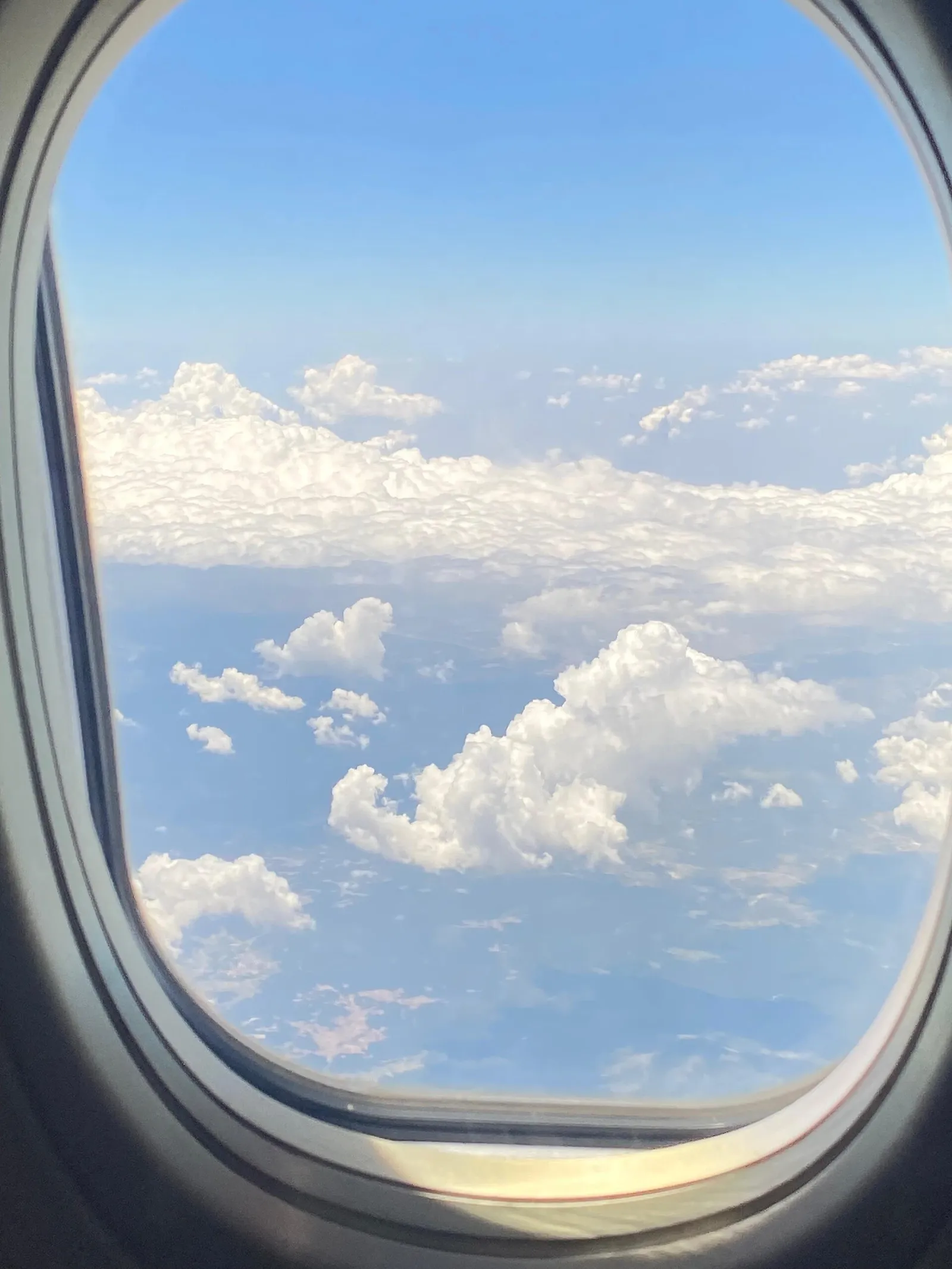 Clouds seen through an aircraft window